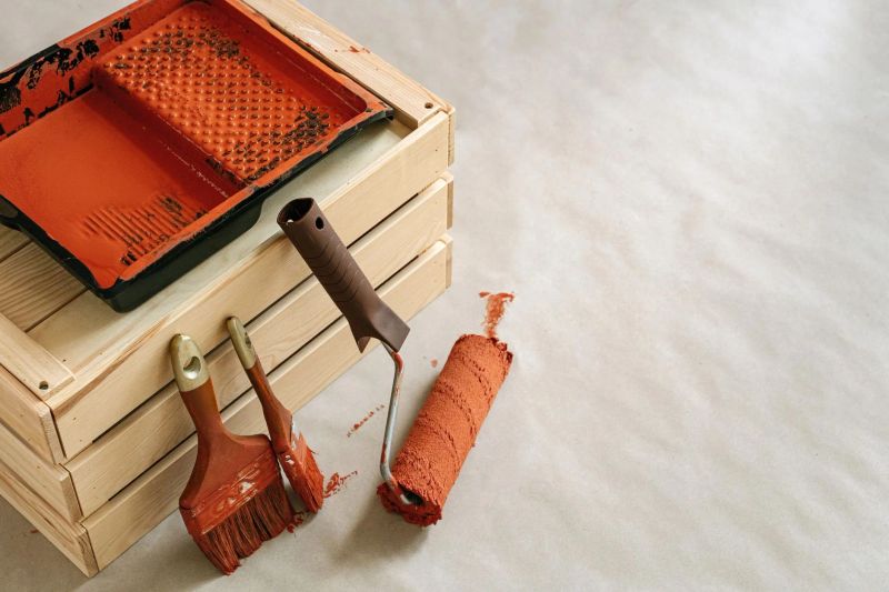 Handyman repairing kitchen cabinetry in Madison