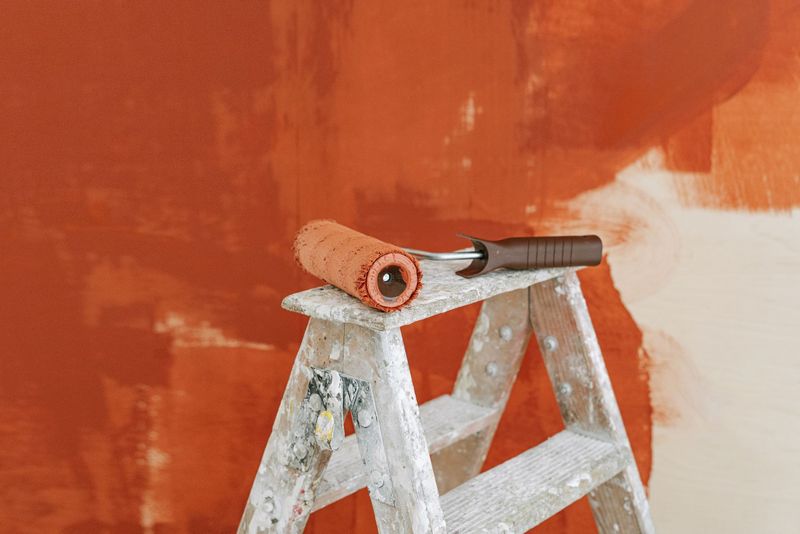 Handyman installing a light fixture in Madison