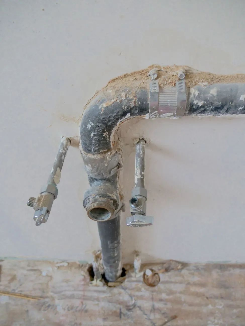 Handyman repairing a kitchen faucet in a Madison home